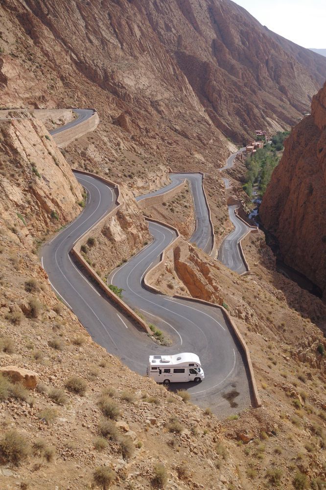 Dades Valley winding road through dramatic red rock formations